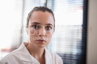 Close-up portrait of worried young female therapist