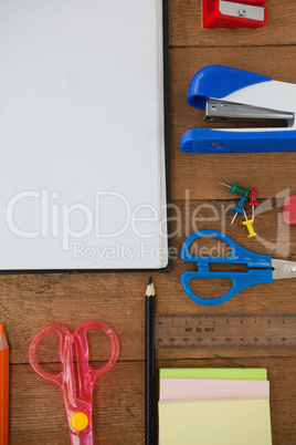 Various school supplies on wooden table