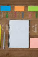 Various school supplies arranged on wooden table