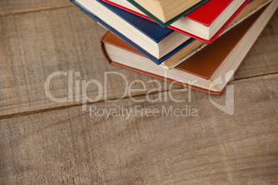 Stack of books on wooden background