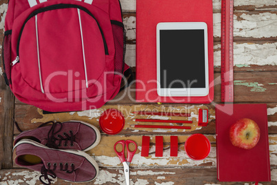 Bagpack, shoes, digital tablet, apple and stationary