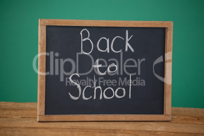 Slate with text back to school on table