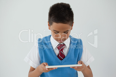 Schoolboy using digital tablet