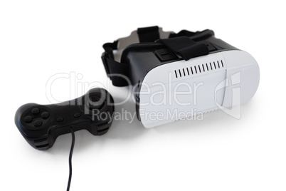 Virtual reality headset and joystick on white background