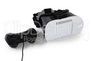 Virtual reality headset and joystick on white background