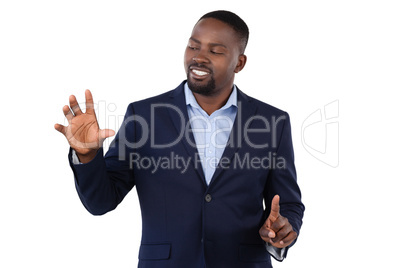 Businessman pressing an invisible virtual screen