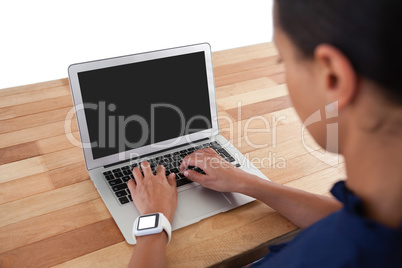 Businesswoman using laptop on the table