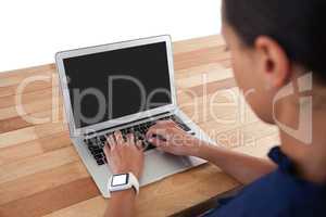 Businesswoman using laptop on the table