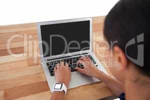 Businesswoman using laptop on the table