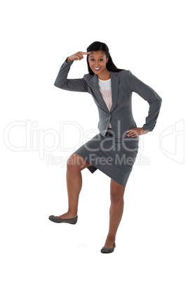 Excited businesswoman dancing against white background