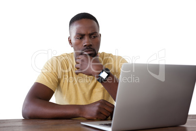 Man using laptop against white background