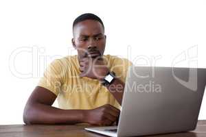 Man using laptop against white background