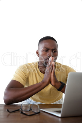 Man using laptop against white background