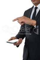 Mid section of business man using smart phone