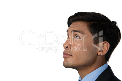 Side view of businessman looking up