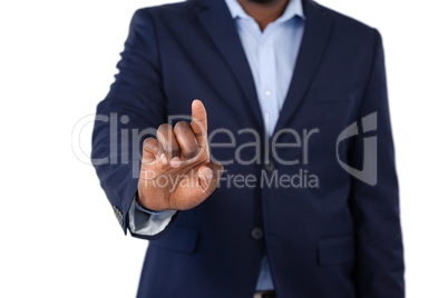 Businessman pressing an invisible virtual screen