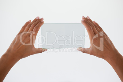 Hand holding a glass smartphone