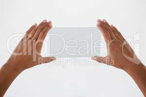 Hand holding a glass smartphone