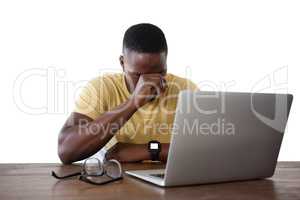 Man using laptop against white background