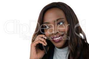 Close up of businesswoman looking away while talking on mobile phone
