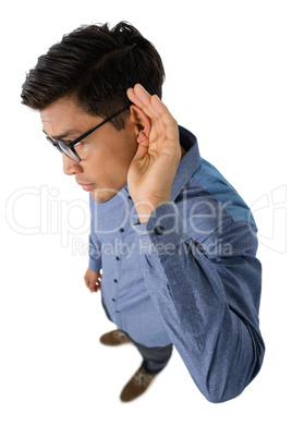 High angle view of businessman cupping ears