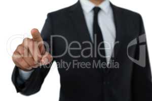 Mid section of businessman with pointing gesture