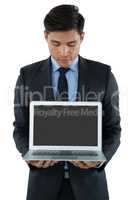Businessman showing laptop