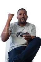 Man playing video game against white background