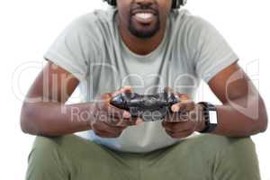 Man playing video game against white background