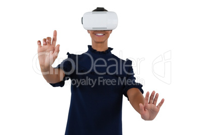 Woman gesturing while using virtual reality headset