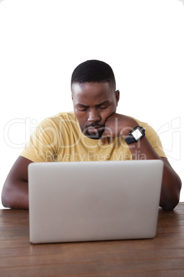 Man using laptop against white background