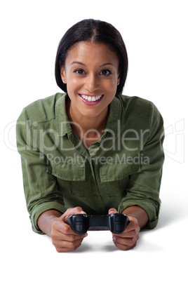 Woman playing video game against white background