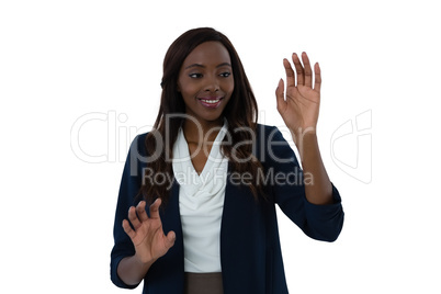 Smiling young businesswoman using interface screen