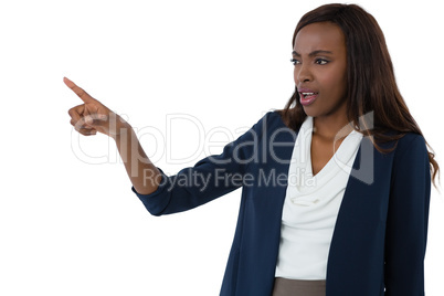 Businesswoman pointing while giving presentation