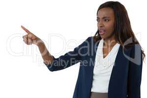 Businesswoman pointing while giving presentation