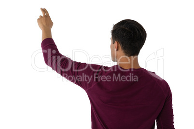 Businessman touching invisible imaginary screen