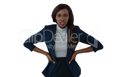 Portrait of irritated businesswoman with hands on hip