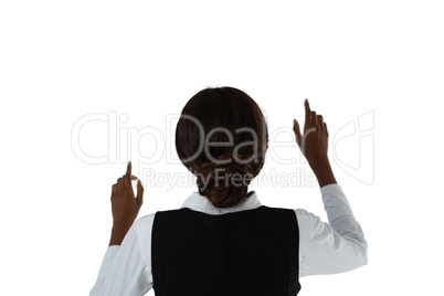 Rear view of businesswoman using interface