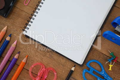 Various school supplies on wooden table