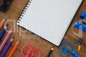 Various school supplies on wooden table