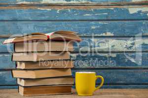 Stack of books and coffee cup