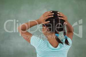 Young girl holding her head