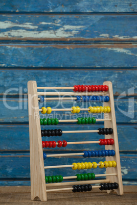 Abbacus game against wooden background
