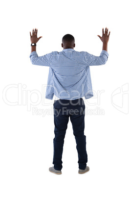 Man pretending to touch an invisible screen against white background