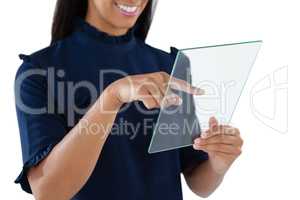 Female executive using a glass digital tablet