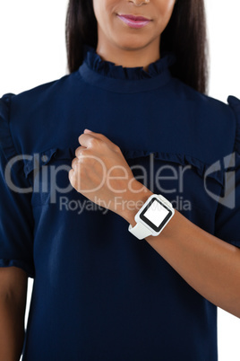 Female executive showing her smartwatch