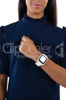 Female executive showing her smartwatch