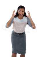 Businesswoman shouting against white background