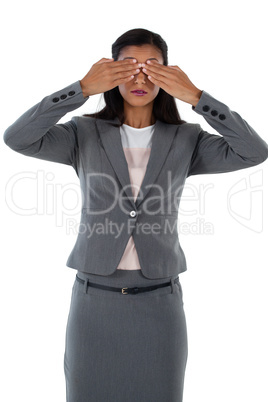 Businesswoman covering her eyes