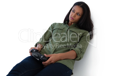 Thoughtful woman playing video games